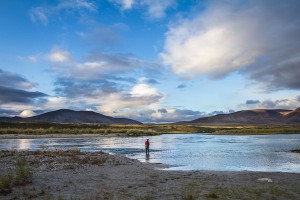 A man fishes in the Noatak River in Noatak National Preserve, Alaska, USA.